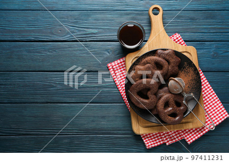 Concept of tasty bakery, gingerbread cookies in chocolate, space for text Concept of tasty bakery, gingerbread cookies in chocolate, space for text 97411231