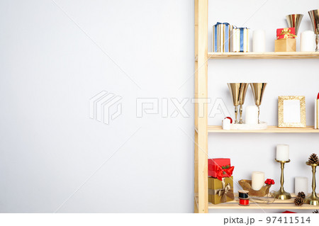 Shelving with different Christmas accessories, space for text 97411514