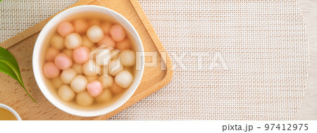 Red and white tangyuan with syrup soup. Red and white tangyuan with syrup soup. 97412975