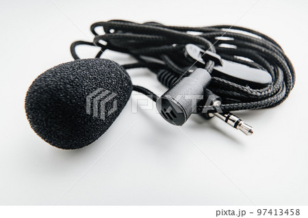 Buttonhole on a white background. Compact microphone for audio recording. 97413458