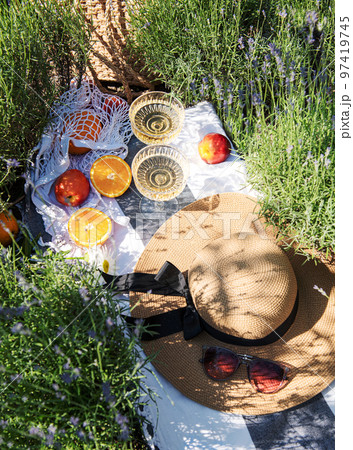 Summer picnic on a lavender field Summer picnic on a lavender field 97419745