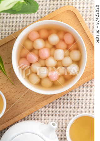 Red and white tangyuan with syrup soup. Red and white tangyuan with syrup soup. 97422020