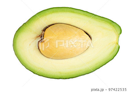 Avocado cut in half with bone isolated on white. Fresh vegetables. Avocado cut in half with bone isolated on white. Fresh vegetables. 97422535