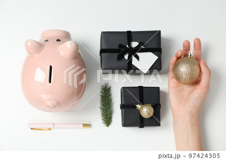 Concept of Christmas finance with piggy bank, top view Concept of Christmas finance with piggy bank, top view 97424305