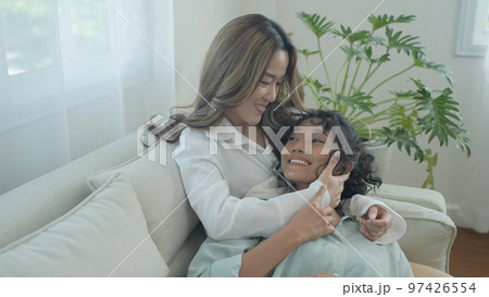 Holiday concept of 4k Resolution. Asian women embracing each other in the house. Young women are in a mutual lesbian love relationship. 97426554