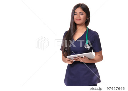 Young pretty doctor with a stethoscope and a medical history in her arms Young pretty doctor with a stethoscope and a medical history in her arms 97427646