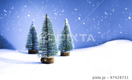 Christmas tree decor on a blue background. New Year's card with snow 97428731