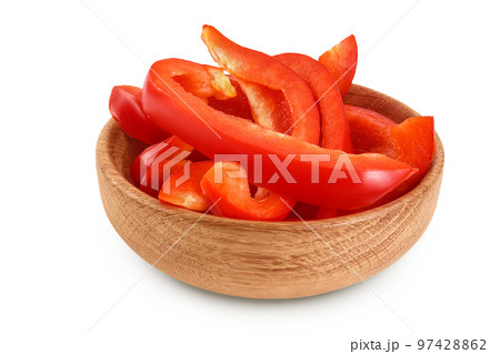 slices of red sweet bell pepper in wooden bowl isolated on white background with full depth of field 97428862