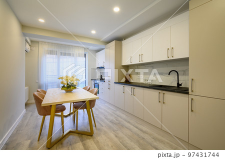 Large beige and cream luxury kitchen interior 97431744