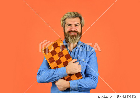 Cognitive skills. Hobby and leisure. Intellectual games. Chess lesson. Chess figures. Teacher chess competition. Game strategy concept. Board game. Man playing chess. Intelligent bearded hipster. Cognitive skills. Hobby and leisure. Intellectual games. Chess lesson. Chess figures. Teacher chess competition. Game strategy concept. Board game. Man playing chess. Intelligent bearded hipster. 97438485