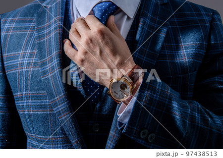 closeup of businessperson in wristwatch. businessperson wearing wristwatch. photo of businessperson closeup of businessperson in wristwatch. businessperson wearing wristwatch. photo of businessperson 97438513