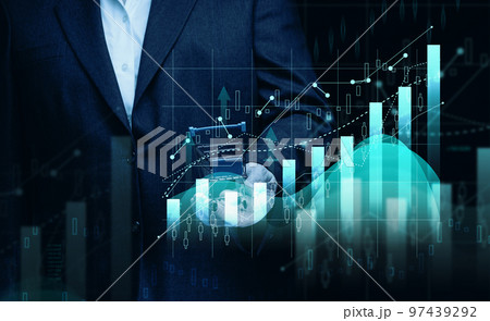 Man in a black suit holds a miniature cart against the background of a holographic graph with increasing indicators. 97439292