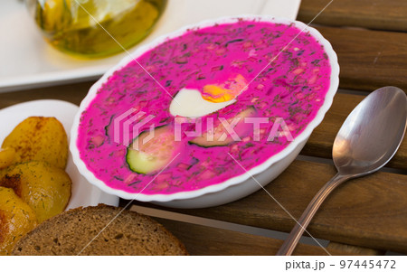 Plate with cold borscht is refreshing dish 97445472