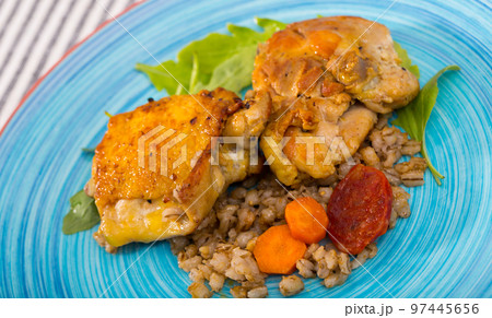 Chicken thighs with barley porridge, vegetables, arugula Chicken thighs with barley porridge, vegetables, arugula 97445656