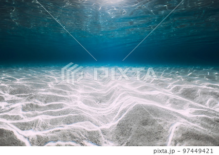 Blue ocean with white sand underwater in Hawaii. Transparent sea water and sandy bottom 97449421