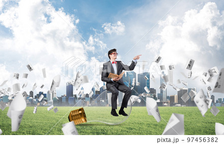 young businessman with a book 97456382