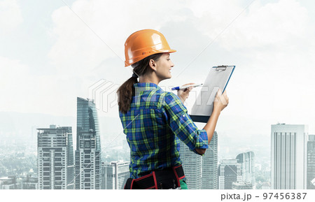 Young building controller with clipboard 97456387