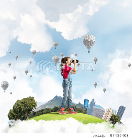 Concept of careless happy childhood with girl looking in future 97456403