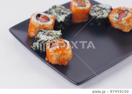 set of Sushi rolls on black plate 97459150