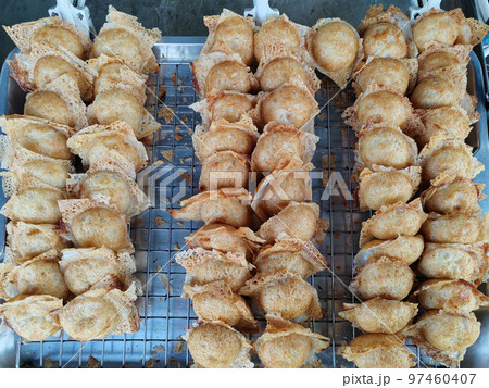 Khanom Krok, traditional Thai dessert, made from coconut, coconut milk and flour in a round shape. 97460407