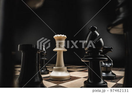 Chess board with figures on dark background 97462131