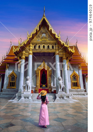 Tourists walking at Wat Benchamabophit or the Marble Temple in Bangkok, Thailand. Tourists walking at Wat Benchamabophit or the Marble Temple in Bangkok, Thailand. 97464019