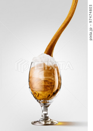 Creative artwork with glass of light beer made from yellow and white cloth imitating real beer drink. Imagination, art, Oktoberfest, ideas, ad Creative artwork with glass of light beer made from yellow and white cloth imitating real beer drink. Imagination, art, Oktoberfest, ideas, ad 97474803