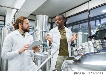 Technologists Working at Brewery 97476411