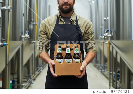 Brewer Showing Bottled Beer Brewer Showing Bottled Beer 97476421