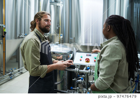 Brewery Manager Talking to Employee Brewery Manager Talking to Employee 97476479
