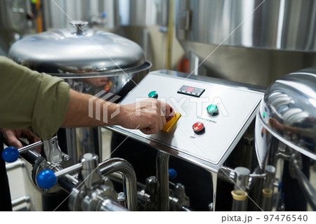 Worker Launching Brewery Equipment 97476540