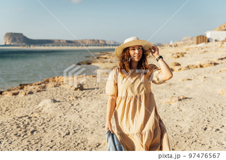 Beautiful sexy girl walks and poses for a photo on the island of Crete near Balos bay Beautiful sexy girl walks and poses for a photo on the island of Crete near Balos bay 97476567