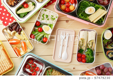 Containers with healthy food on wooden background top view. 97479230