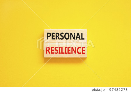 Personal resilience symbol. Concept word Personal resilience typed on wooden blocks. Beautiful yellow table yellow background. Business psychological and personal resilience concept. Copy space. 97482273