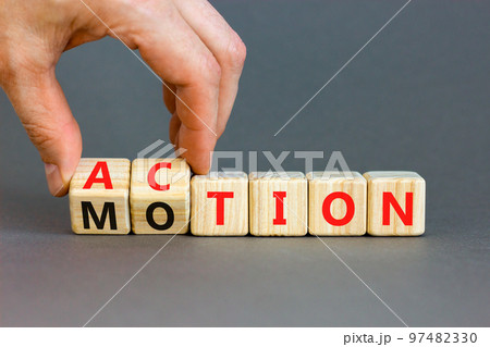 Action or motion symbol. Concept word Motion and Action on wooden cubes. Businessman hand. Beautiful grey table grey background. Business and action or motion concept. Copy space. Action or motion symbol. Concept word Motion and Action on wooden cubes. Businessman hand. Beautiful grey table grey background. Business and action or motion concept. Copy space. 97482330