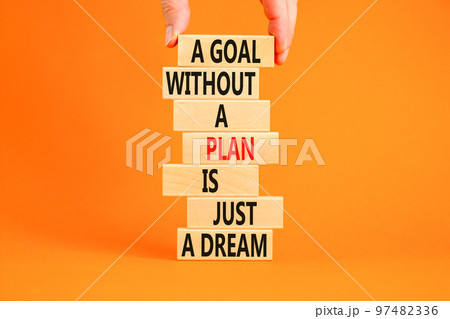 Goal and plan symbol. Concept words A goal without a plan is just a dream on wooden blocks. Beautiful orange background copy space. Businessman hand. Business plan motivational goal or dream concept. Goal and plan symbol. Concept words A goal without a plan is just a dream on wooden blocks. Beautiful orange background copy space. Businessman hand. Business plan motivational goal or dream concept. 97482336