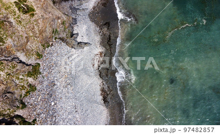 Beautiful rocky beach on the south coast of Ireland near Clonakilty. The picturesque coast of the Celtic Sea. Sea surf. Turquoise waters of the Atlantic. Drone photo. View from above. 97482857