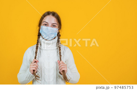 in good mood. patient child wearing respirator mask. safety protective items during coronavirus pandemic outbreak. symptom of covid 19. girl need igg immunity test. virus pneumonia. copy space 97485753