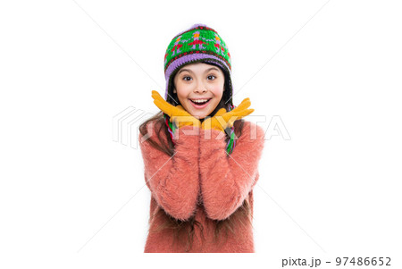 glad teen girl in earflap hat isolated on white background. teen girl wear sweater 97486652