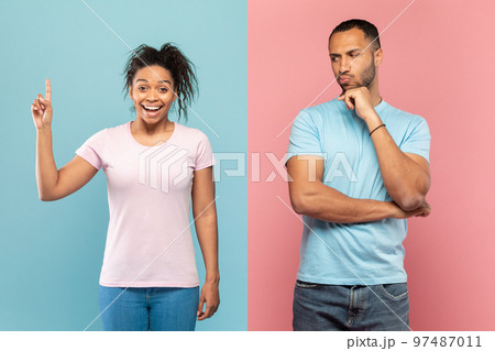Brainstorming. Pensive black man thinking about question and touching chin, woman having idea, pink and blue background Brainstorming. Pensive black man thinking about question and touching chin, woman having idea, pink and blue background 97487011