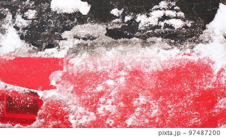 Close-up of snow frozen on a car. The concept of weather conditions Close-up of snow frozen on a car. The concept of weather conditions 97487200