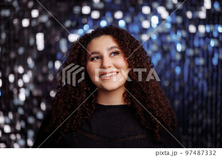 Girl with a curly hairstyle 97487332