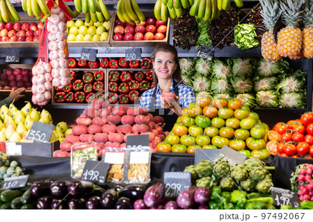 woman offering fresh peaches and fruits 97492067