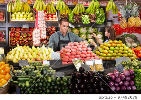 Shop assistants working in fruit and vegetable shop 97492079
