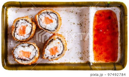Portion of fried sushi maki with salmon 97492784