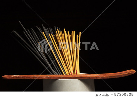 Many different incense sticks with wooden stand Many different incense sticks with wooden stand 97500509