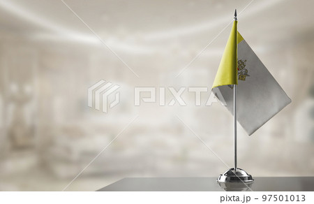 A small Vatican flag on an abstract blurry background 97501013