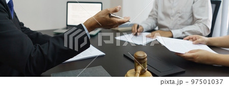 Concept of lawyer counseling, Senior lawyer provides advice to couple about their divorce agreement Concept of lawyer counseling, Senior lawyer provides advice to couple about their divorce agreement 97501037