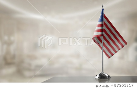 A small Liberia flag on an abstract blurry background 97501517