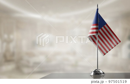 A small Malaysia flag on an abstract blurry background 97501519